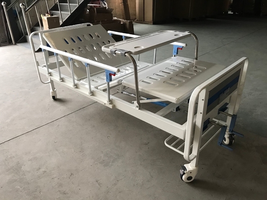 Un letto medico manuale blu e bianco di due funzioni per la clinica
